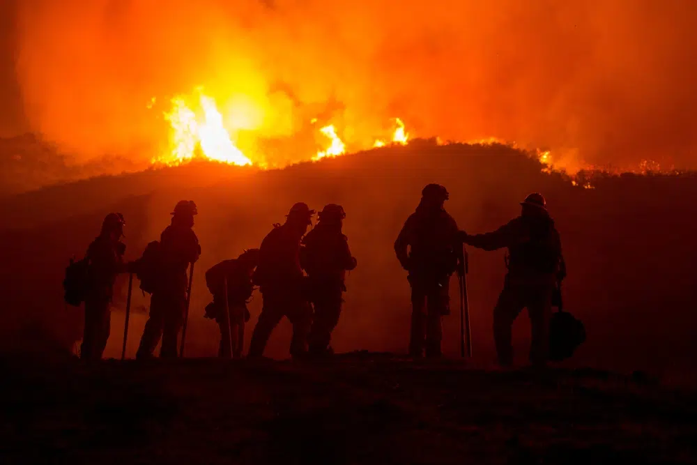 We made wildfire season permanent: firefighters battling the January LA wildfire at night