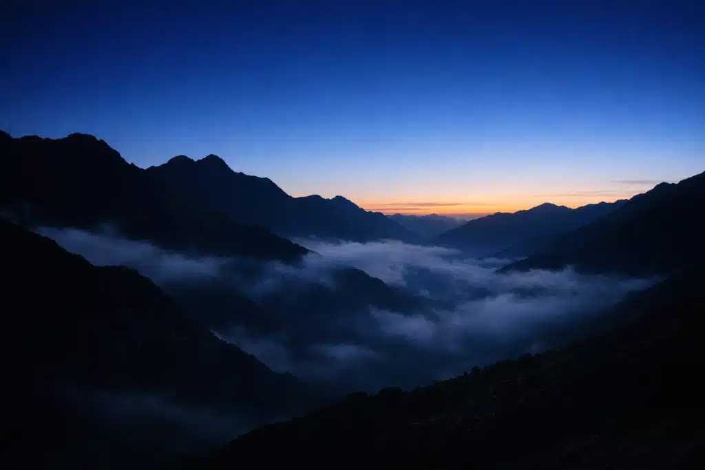 The Journey starts now — sunrise over the mountains at The Hairy Times